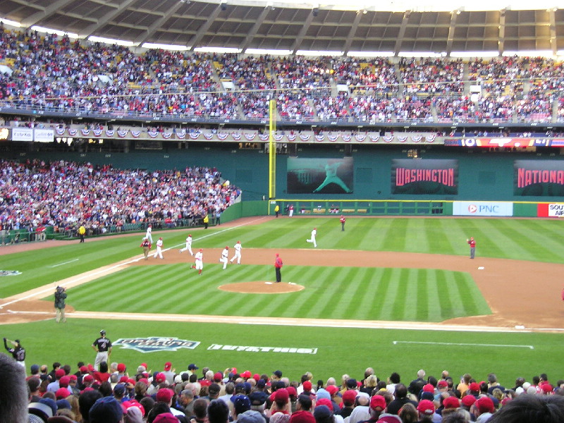 Senators (Howard left, Brinkman short & Bosman pitcher) pass gloves to Nats